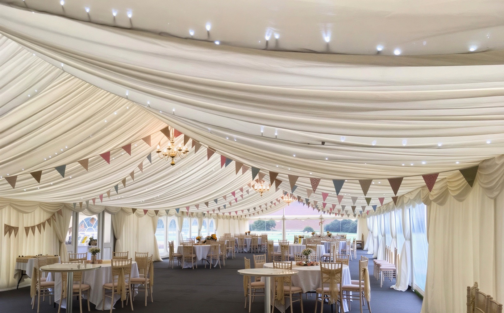 Wedding marquee interior with linings and fairy lights